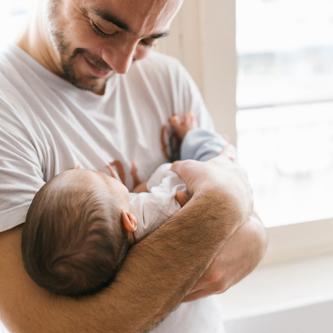 Man holding a young baby