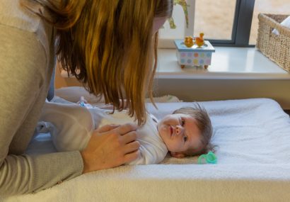 Mum applying deep touch to baby