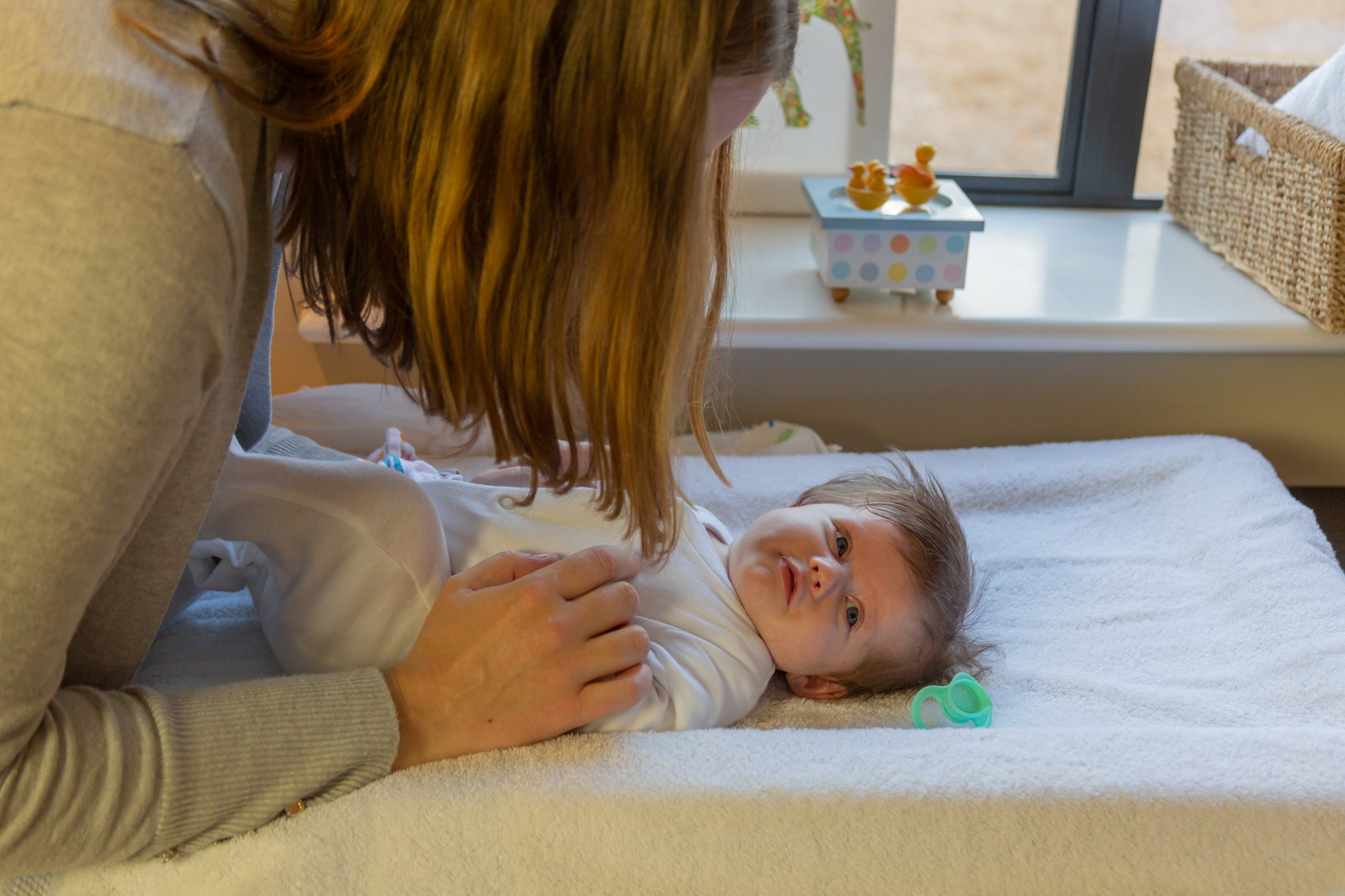 Mum applying deep touch to baby