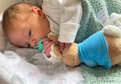 Baby with QUdo and toy